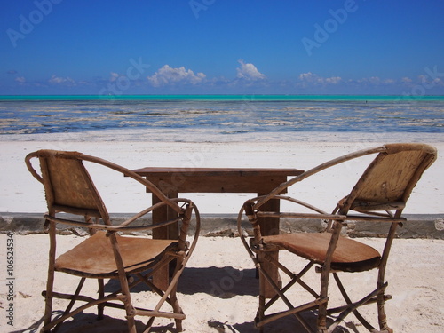 Empty chairs on tropical Indian Ocean beach