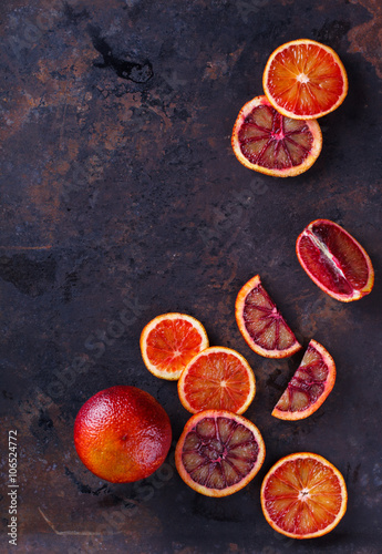 blood orange slices,on a black background.Copy space.selective focus.