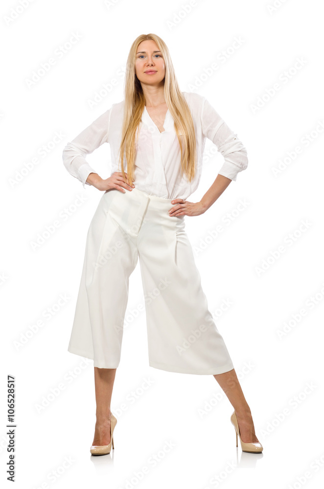 Blond hair model in elegant flared pants isolated on white Blond hair model in elegant flared pants isolated on white