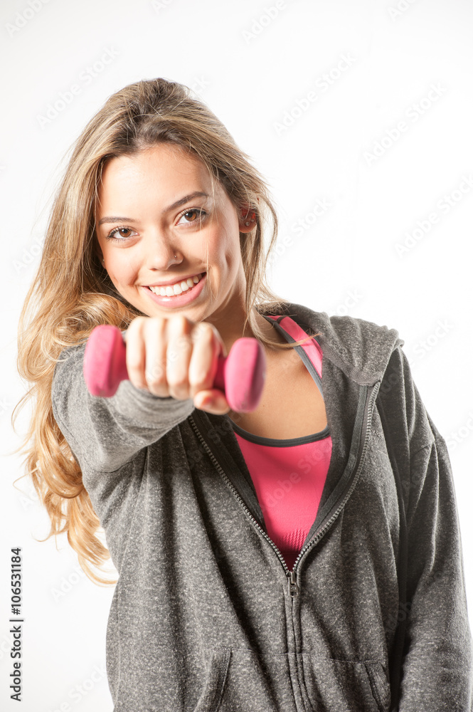 Attractive female fitness model isolated on a white background Attractive female fitness model isolated on a white background