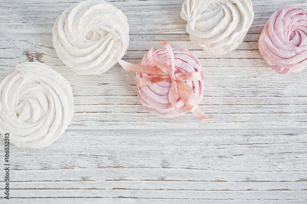 Homemade sweet pink and white marshmallow - zephyr on a light wo