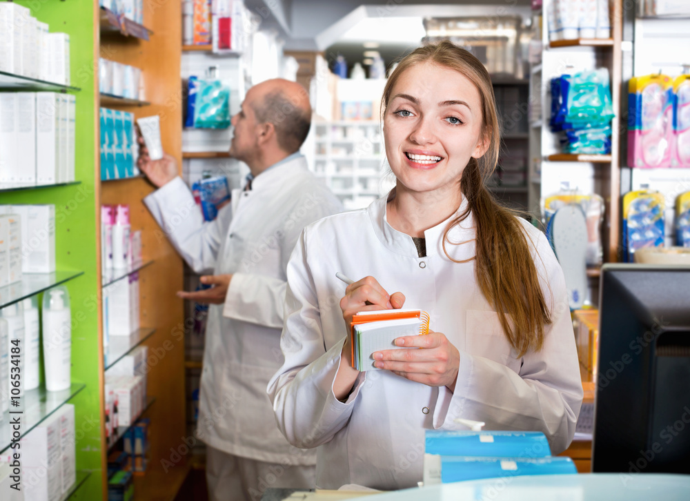 Smiling pleasant pharmacist and pharmacy technician