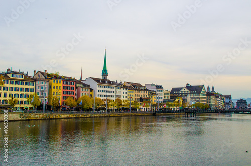 view of a riverside of the limmat river in swiss city zurich taken from the bahnhofbrucke bridge photo