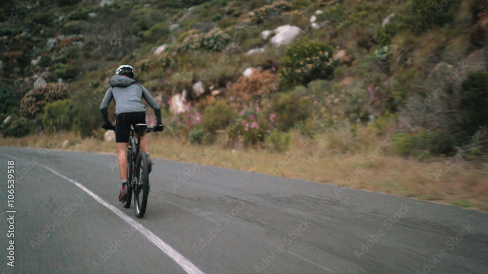 Low angleshot of cyclist busy with cycling fitness training Low angleshot of cyclist busy with cycling fitness training