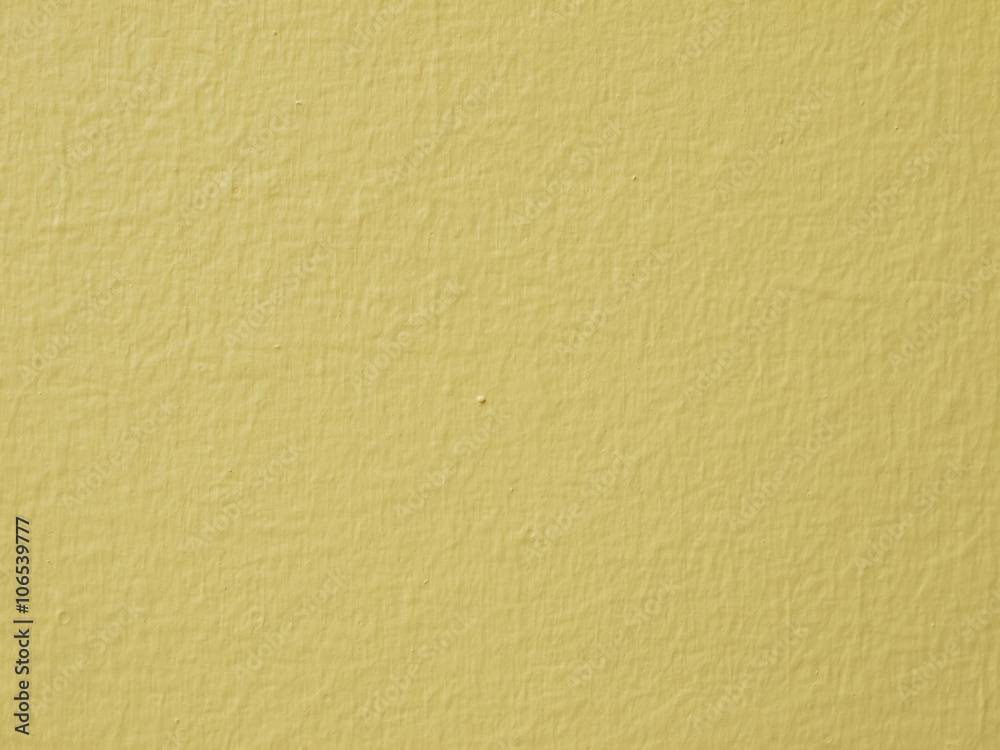 Yellow concrete wall background Yellow concrete wall background