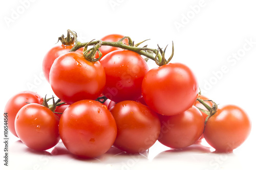 Grape small ripe tomatoes on a pile