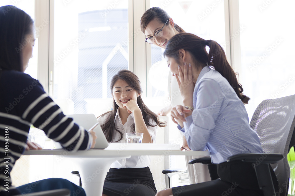 The women have a discussion with a smile The women have a discussion with a smile