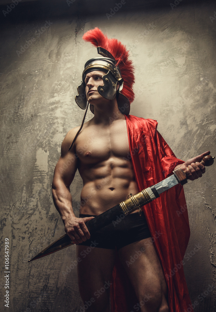 Muscular man in a Roman armour. Muscular man in a Roman armour.