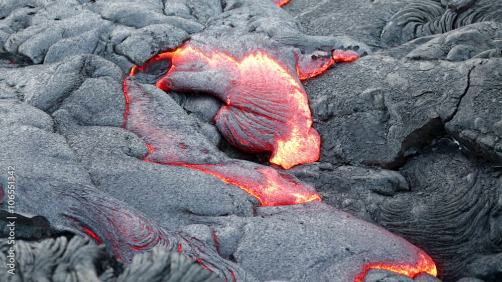 Lava - flowing lava from Kilauea volcano, Big Island, Hawaii. Lava stream flowing in real-time from Kilauea volcano around Hawaii volcanoes national park, USA. Lava - flowing lava from Kilauea volcano, Big Island, Hawaii. Lava stream flowing in real-time from Kilauea volcano around Hawaii volcanoes national park, USA.