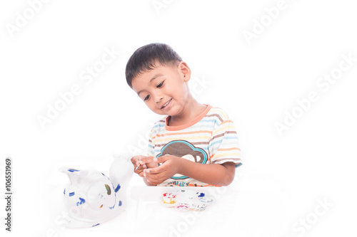 cute little boy playing with paints