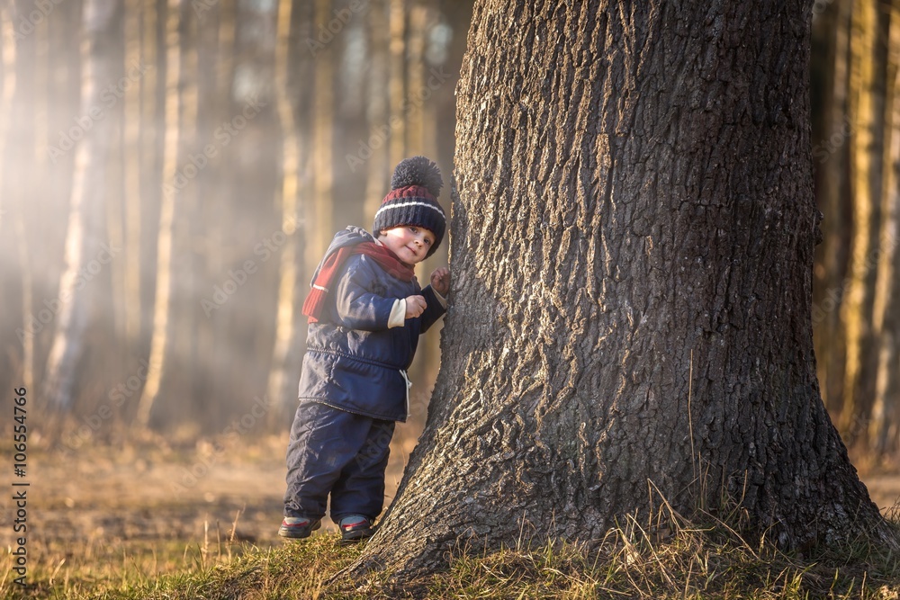 Caucasian boy playing outdoor at springtime