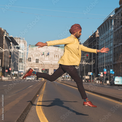 Indian handsome man jumping in an urban context © tinx