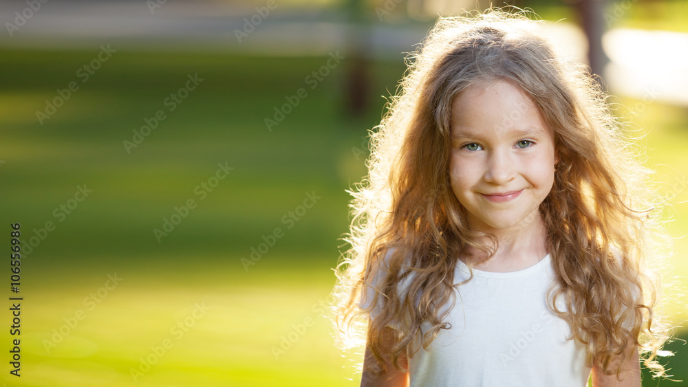Naklejka premium Laughing girl on grass