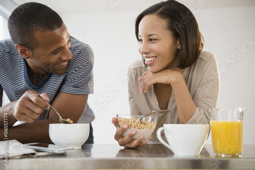 Happy couple eating cereal photo
