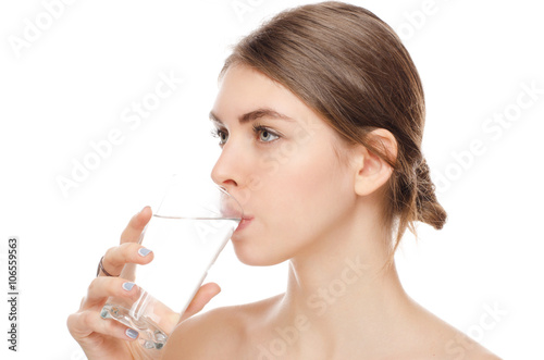 portrait of attractive woman isolated on white studio shot drinking water