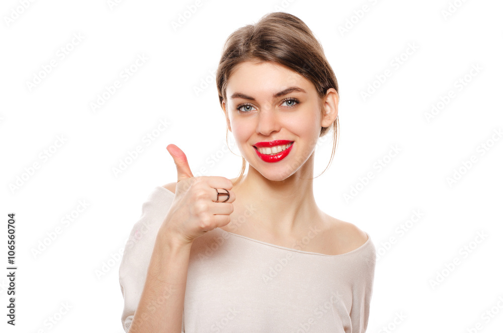 Happy smiling young beautiful woman showing thumbs up gesture, isolated over white background Happy smiling young beautiful woman showing thumbs up gesture, isolated over white background