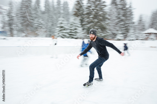 Man ice skating outdoors
