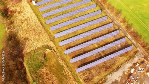 Camera flight over a solar power plant. Renewable resources theme. photo