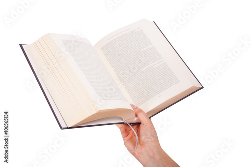 Female hand holding a book isolated on white background