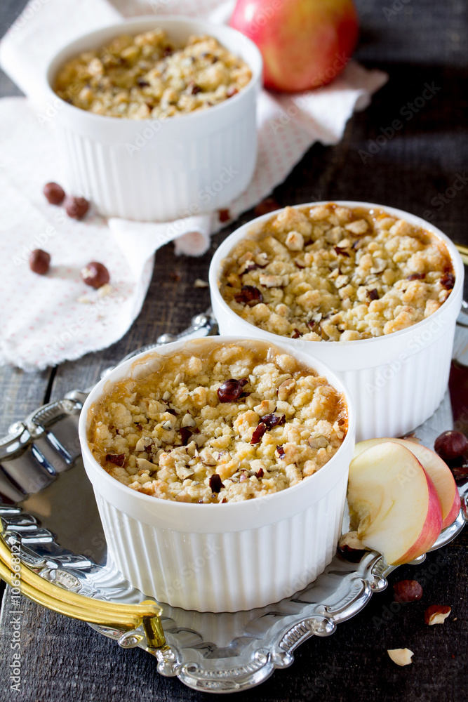 Dessert crumble with apple and nuts in a rustic style Dessert crumble with apple and nuts in a rustic style