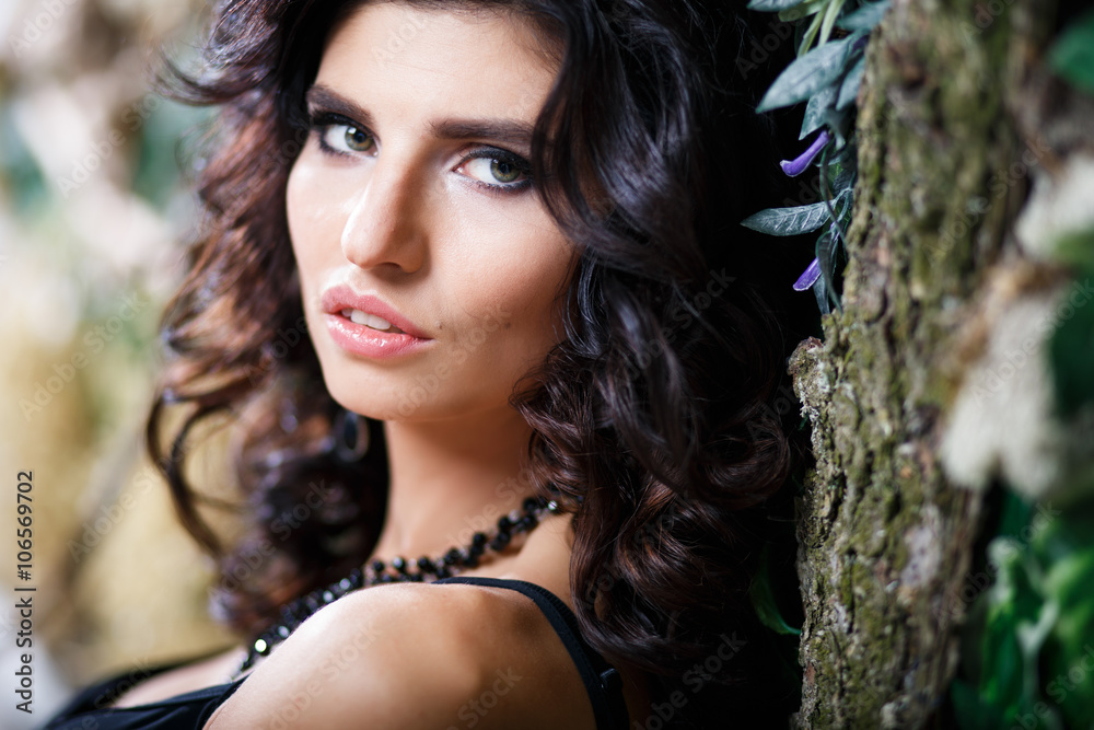 Close-up beauty portrait of gorgeous brunette woman with perfect makeup and hairstyle