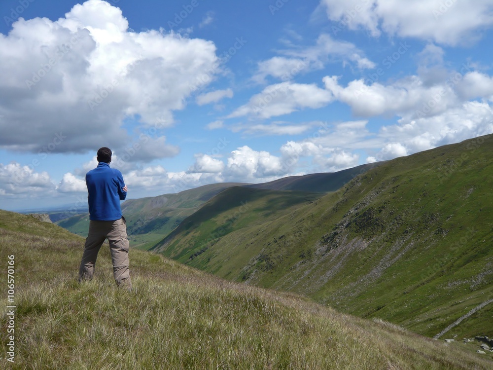 Contemplating a dramatic valley and sky Contemplating a dramatic valley and sky