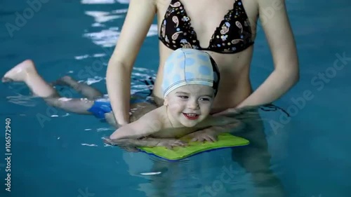 Baby Boy Together With Her Mother in the Swimming Pool photo