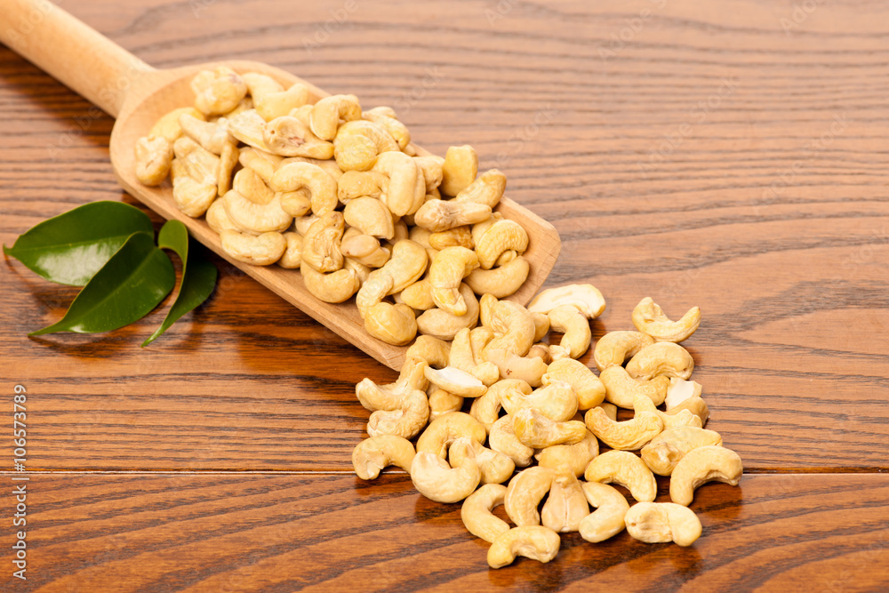 Heap of cashew nuts, healthy snack on wooden background. Heap of cashew nuts, healthy snack on wooden background.