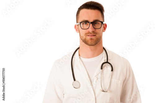 Handsome doctor in white robe with stethoscope around neck.