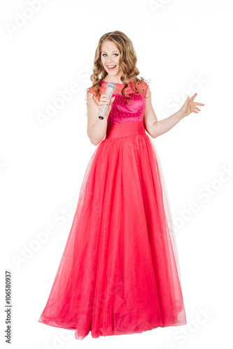 Studio shot beautiful young singing girl in elegant red dress 