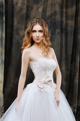 portrait of pretty bride in wedding dress