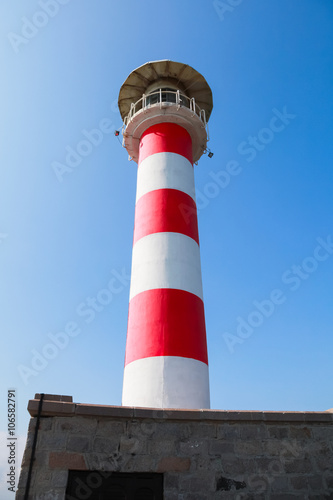 Striped lighthouse tower in port of Burgas