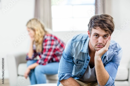 Upset couple sulking each other