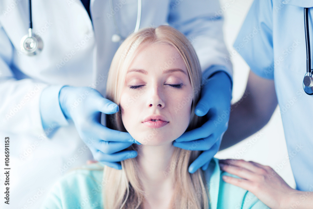 Fototapeta premium plastic surgeon or doctor with patient
