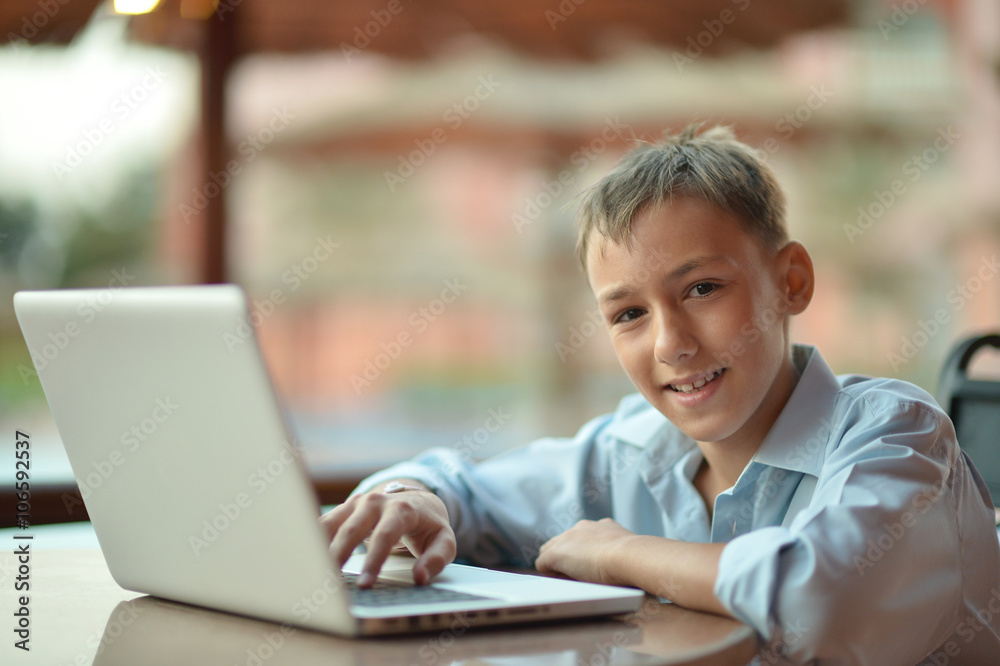 boy sitting with laptop boy sitting with laptop