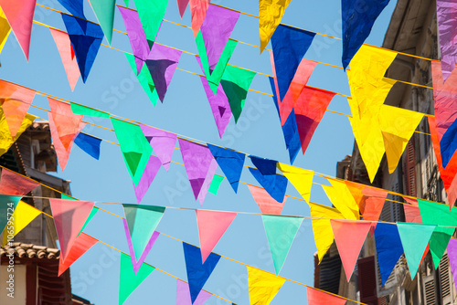 Fotografie Colorful garlands decorating the streets of the city of Bayonne during the summe