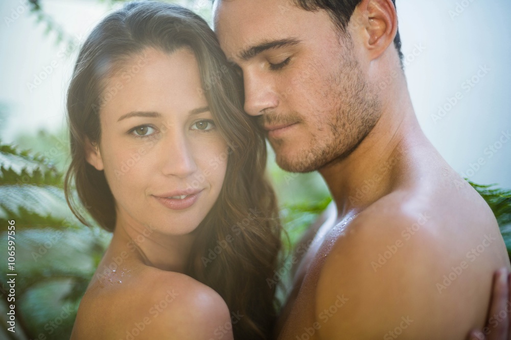 Young couple embracing in garden