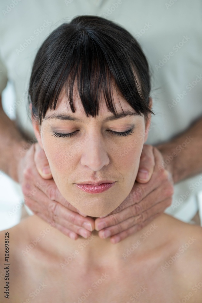 Pregnant woman receiving a massage from masseur Pregnant woman receiving a massage from masseur
