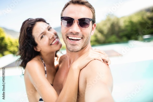 Young couple smiling near pool © WavebreakmediaMicro