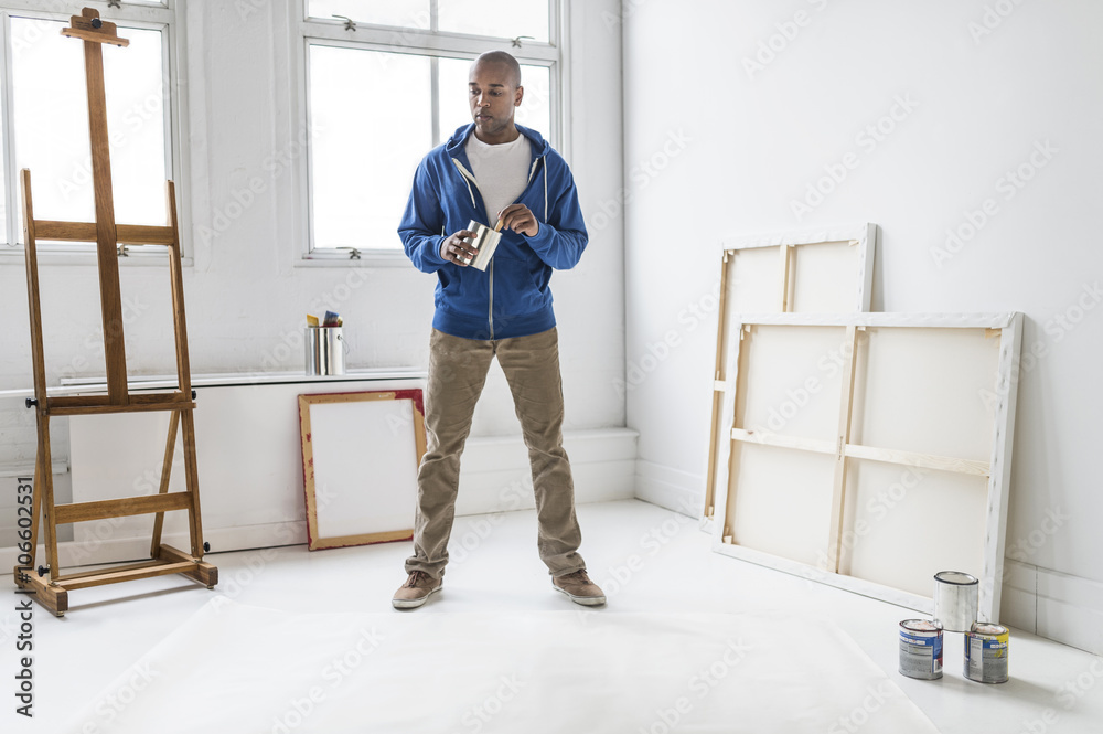 Black artist standing in studio Black artist standing in studio