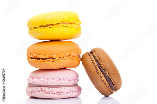 Pile of colorful macarons isolated on white background
