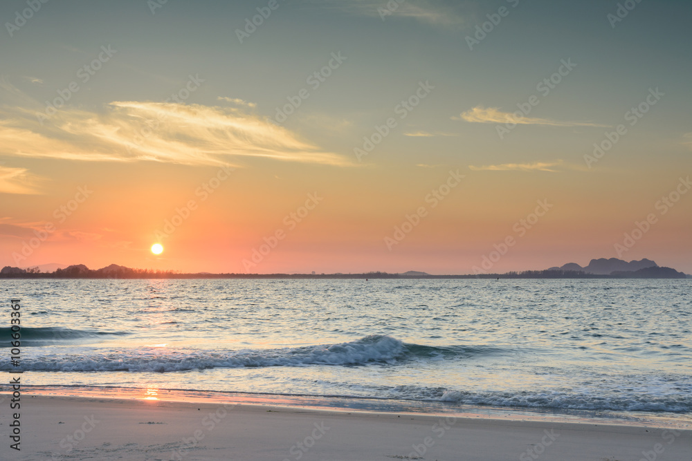 Sunrise on beach with beautiful sky