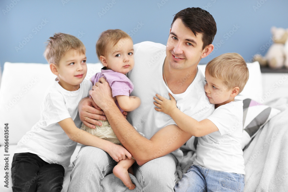 Family concept. Father with sons are in the room Family concept. Father with sons are in the room