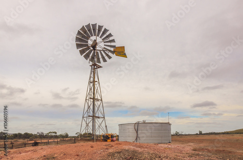 Australian outback old  retro wind powered water pump and storag