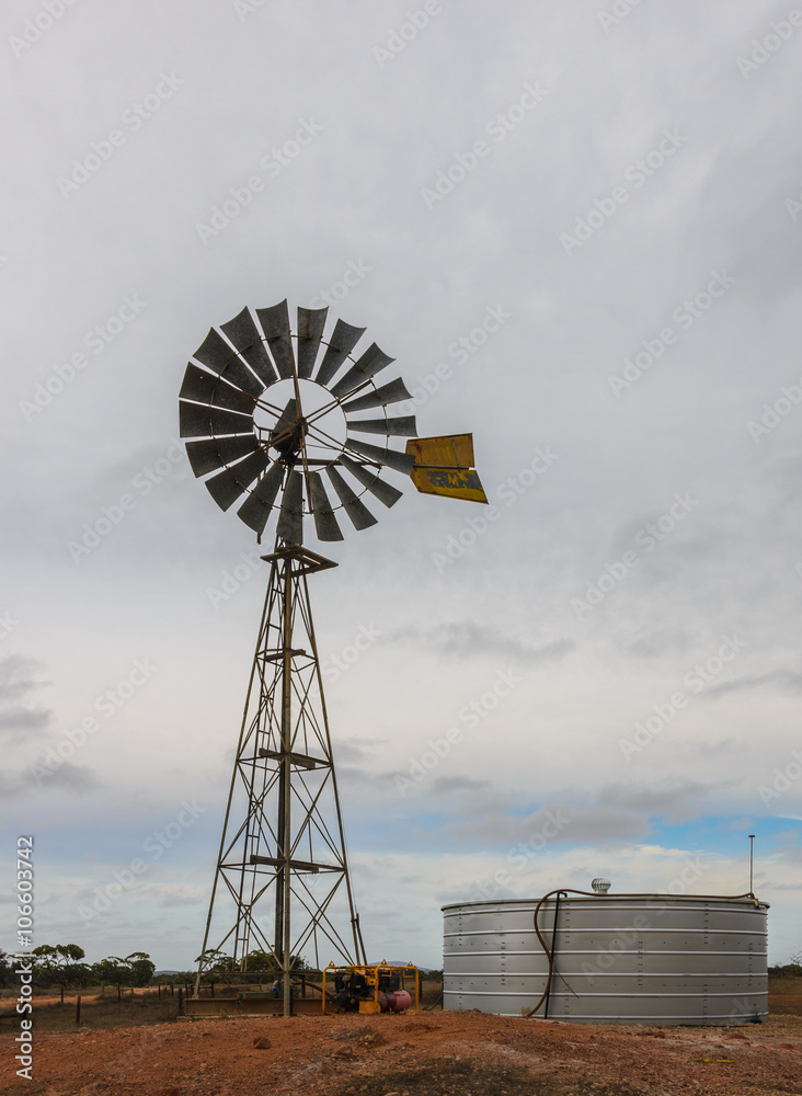 Australian outback old  retro wind powered water pump and storag