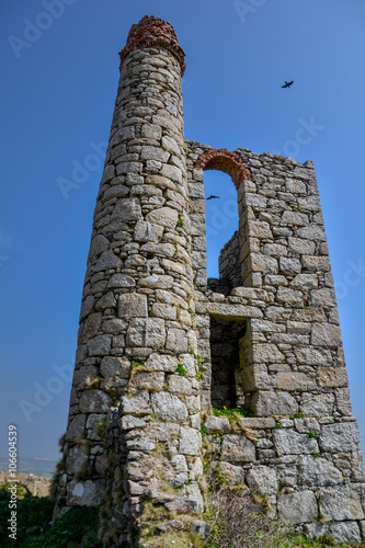 ruins of old mine engine house with broken chimney 
Boskednan, Cornwall, England, United Kingdom photo