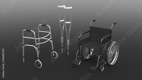 Disability wheelchair, crutch and metallic walker isolated on black photo