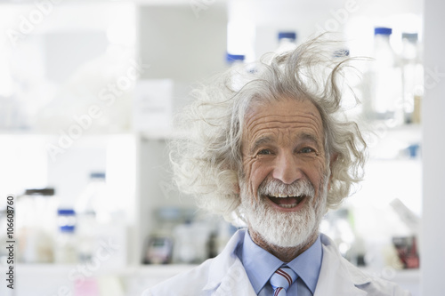 Senior Caucasian scientist with unruly hair in lab photo