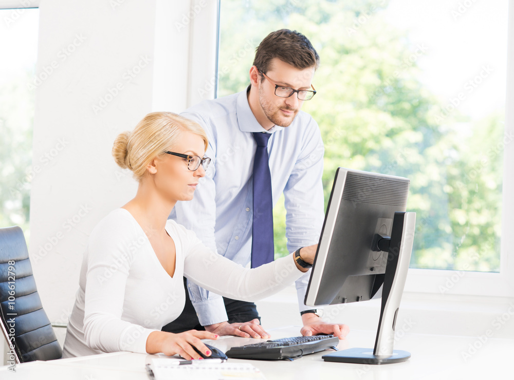 Office workers in formalwear working in office Office workers in formalwear working in office