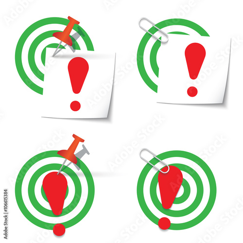 Four targets and thumbtack and paper clip